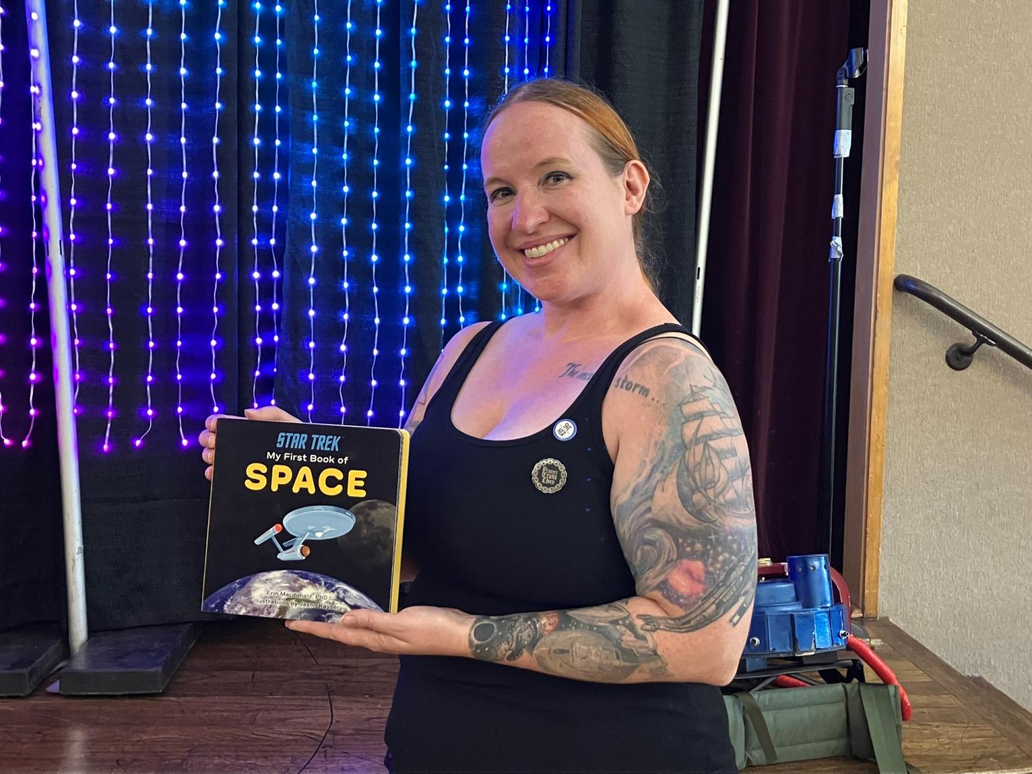 portrait of Erin Macdonald holding "My First Book of Space"