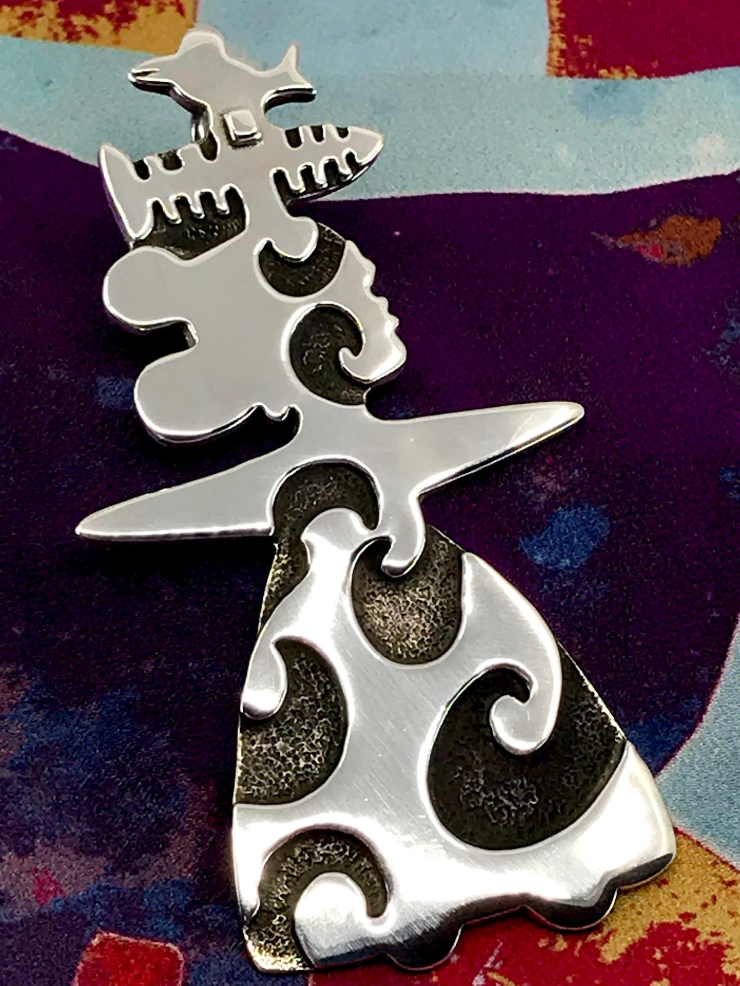Melanie Yazzie silver artwork "She's Singing"