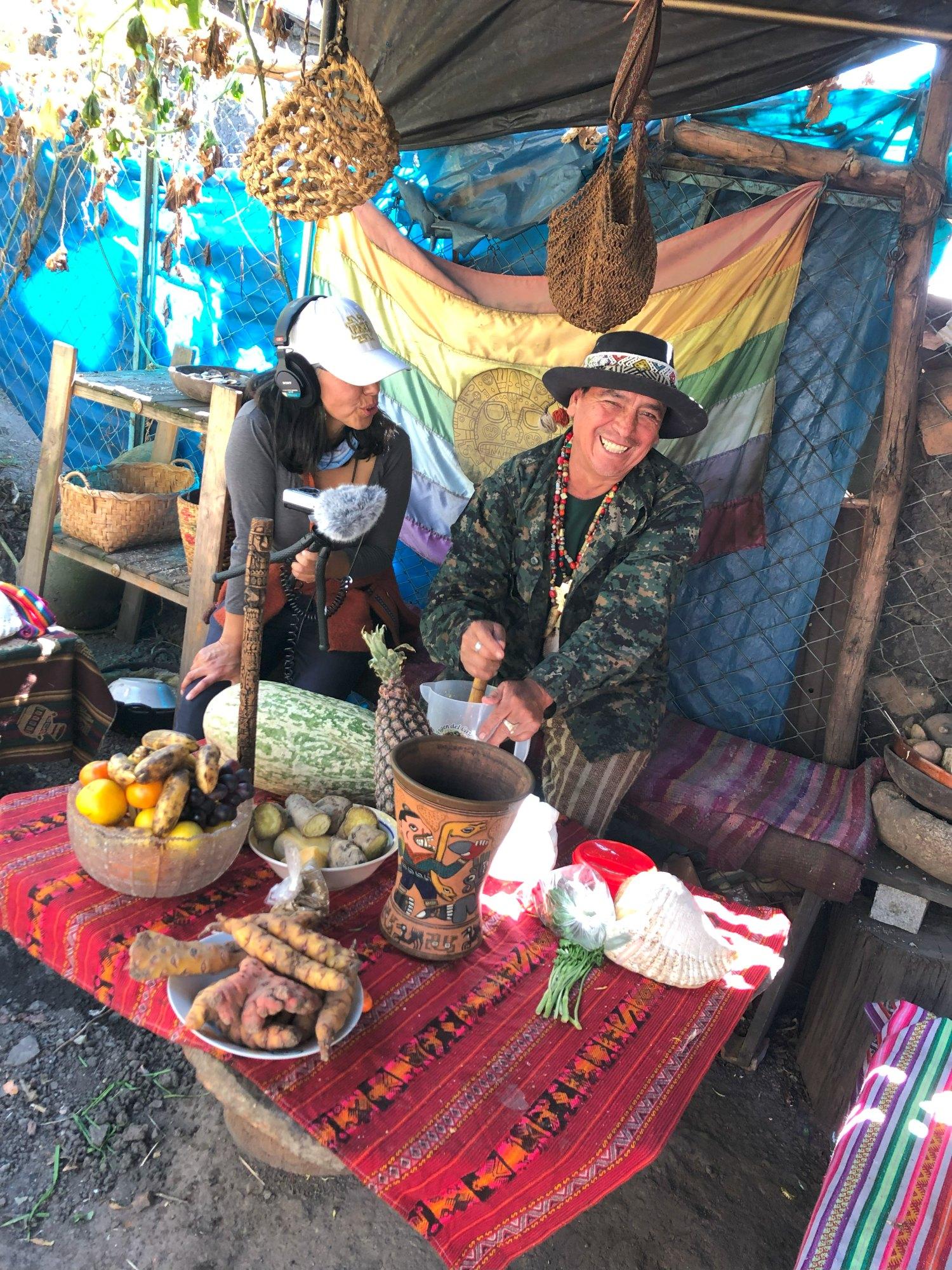Woman audio recording Quechua speaker in market