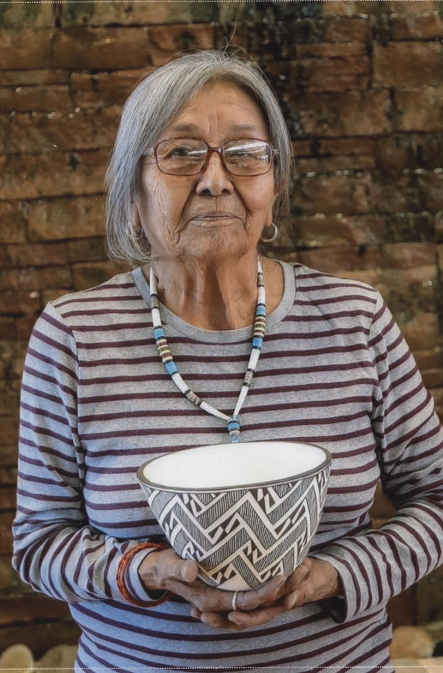 Carmel Lewis Haskaya holding pot