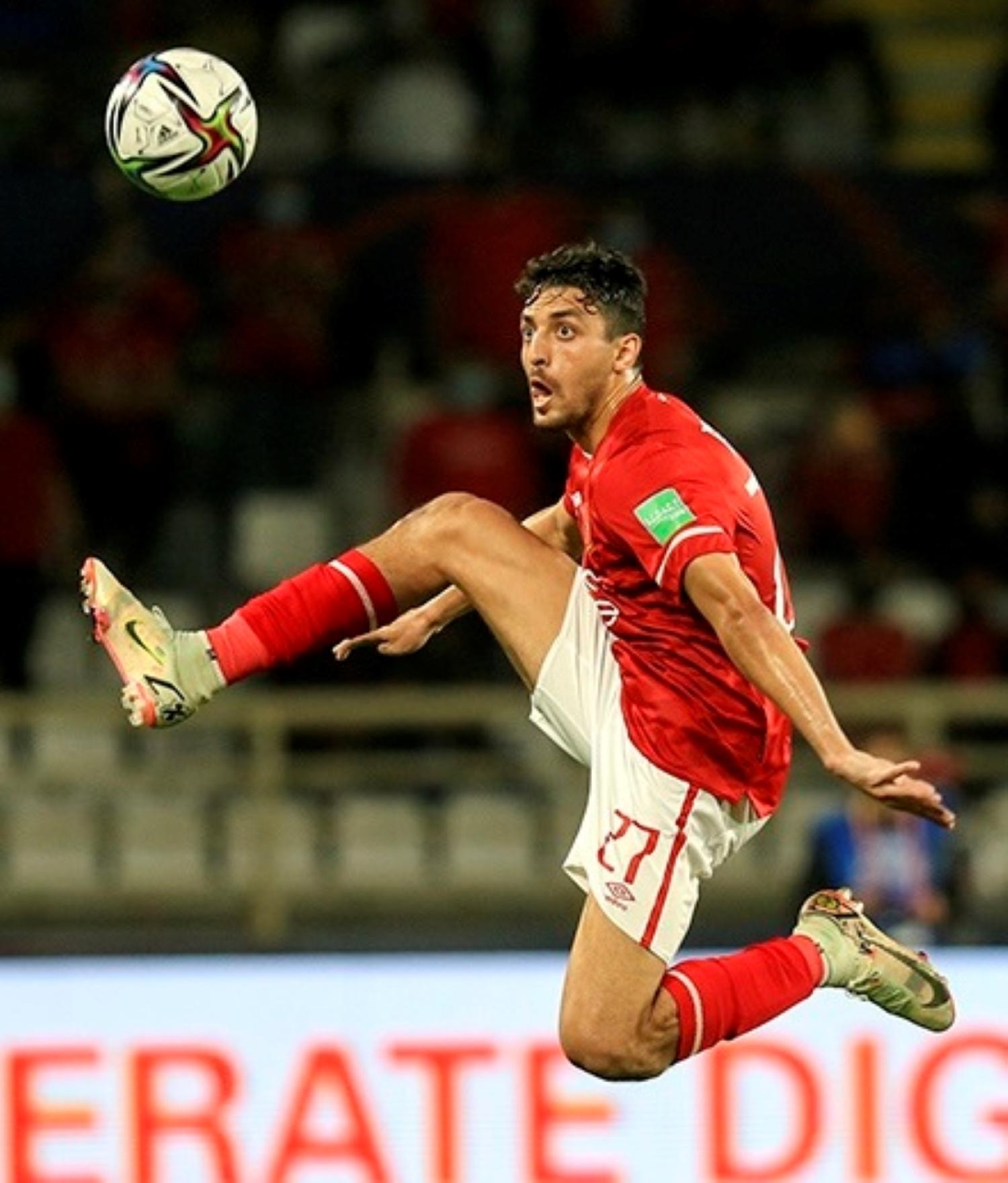 Soccer player Tahed Mohammed kicking ball