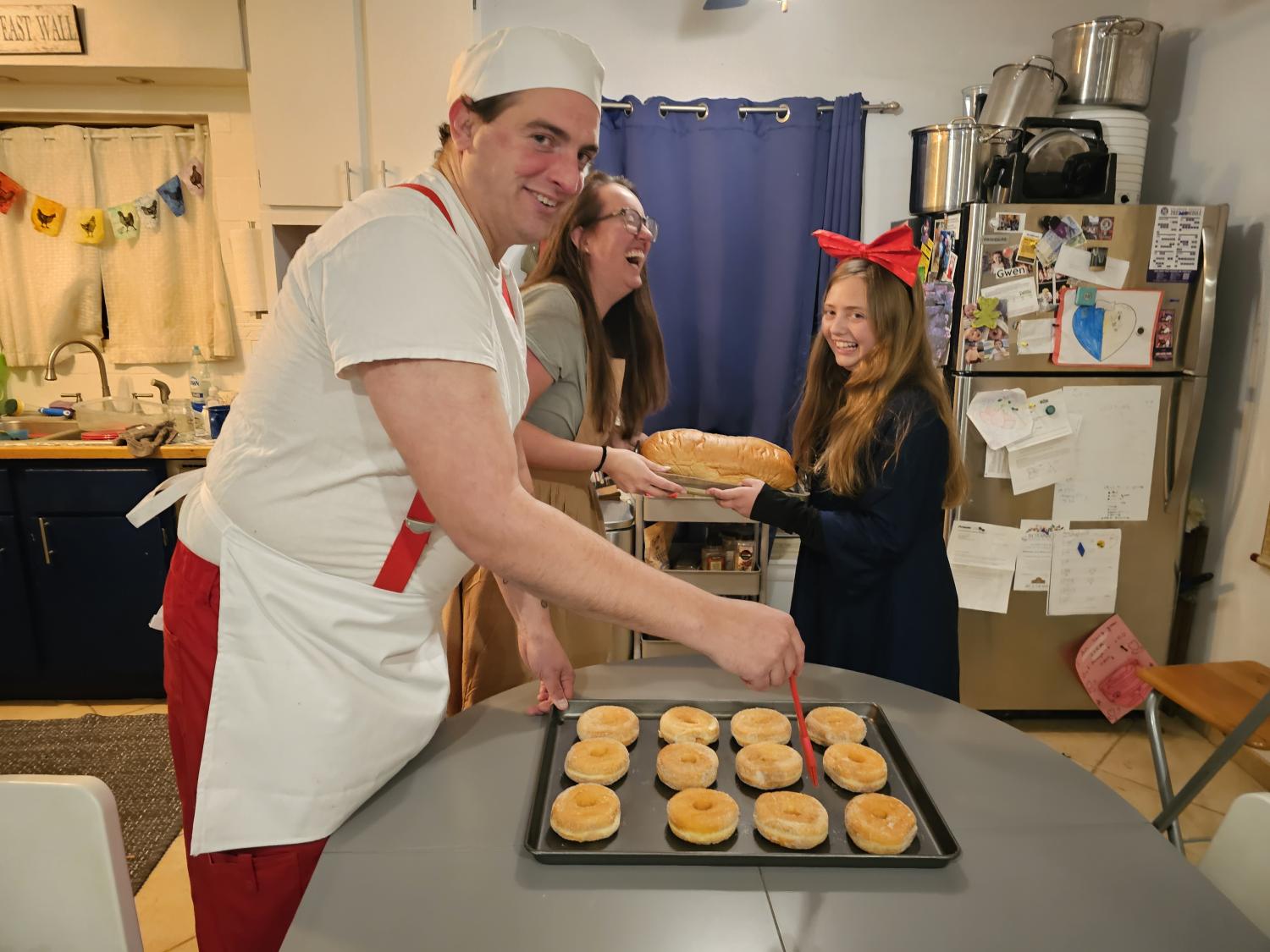 Gregor MacGregor making donuts with and daughter