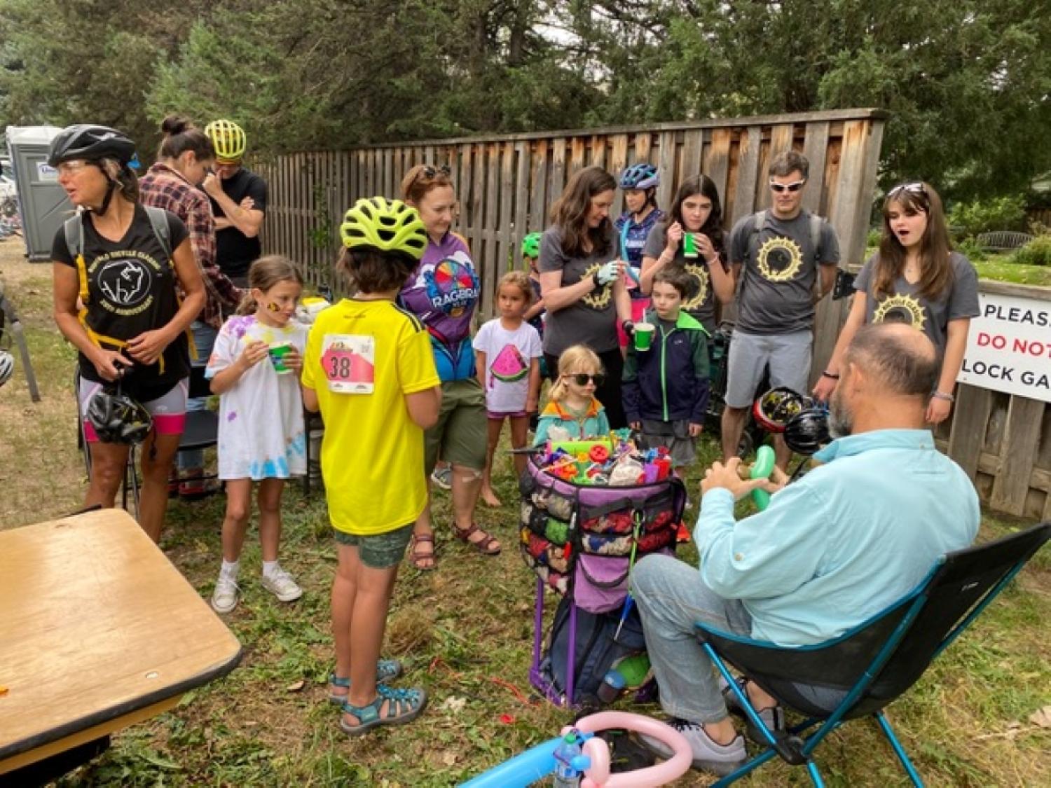 A man making balloon animals at the Little Buff aid station