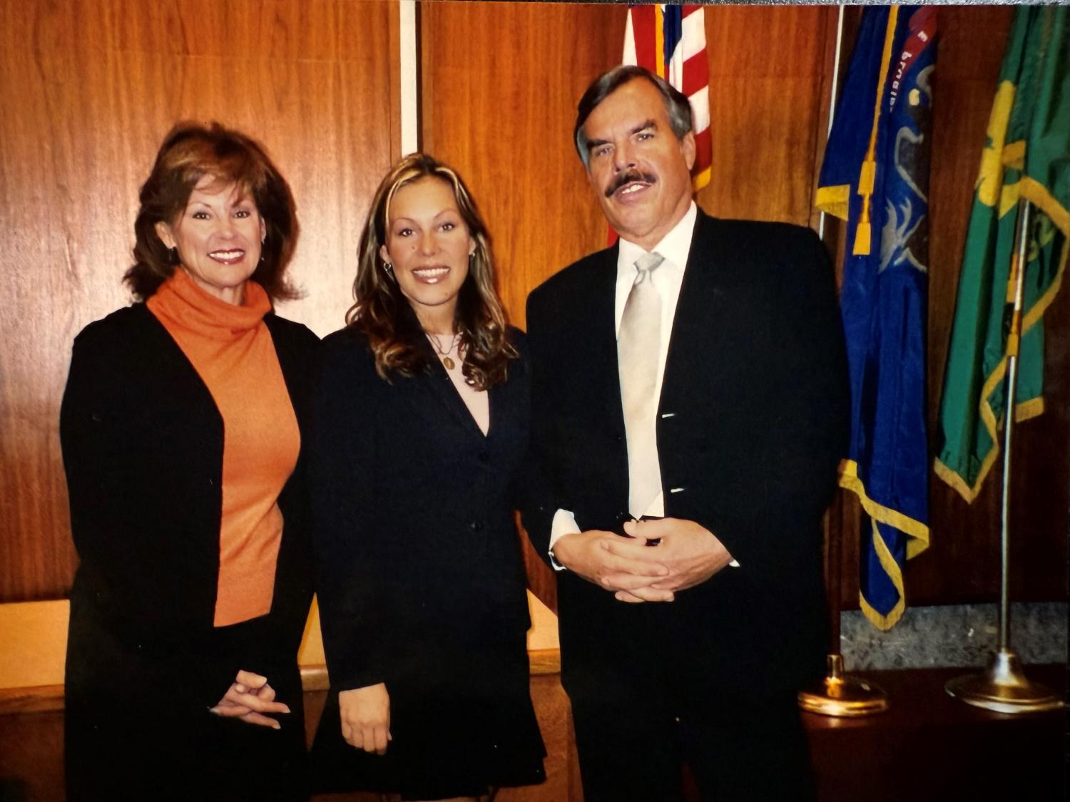 Maureen McGinnis in courtroom with parents