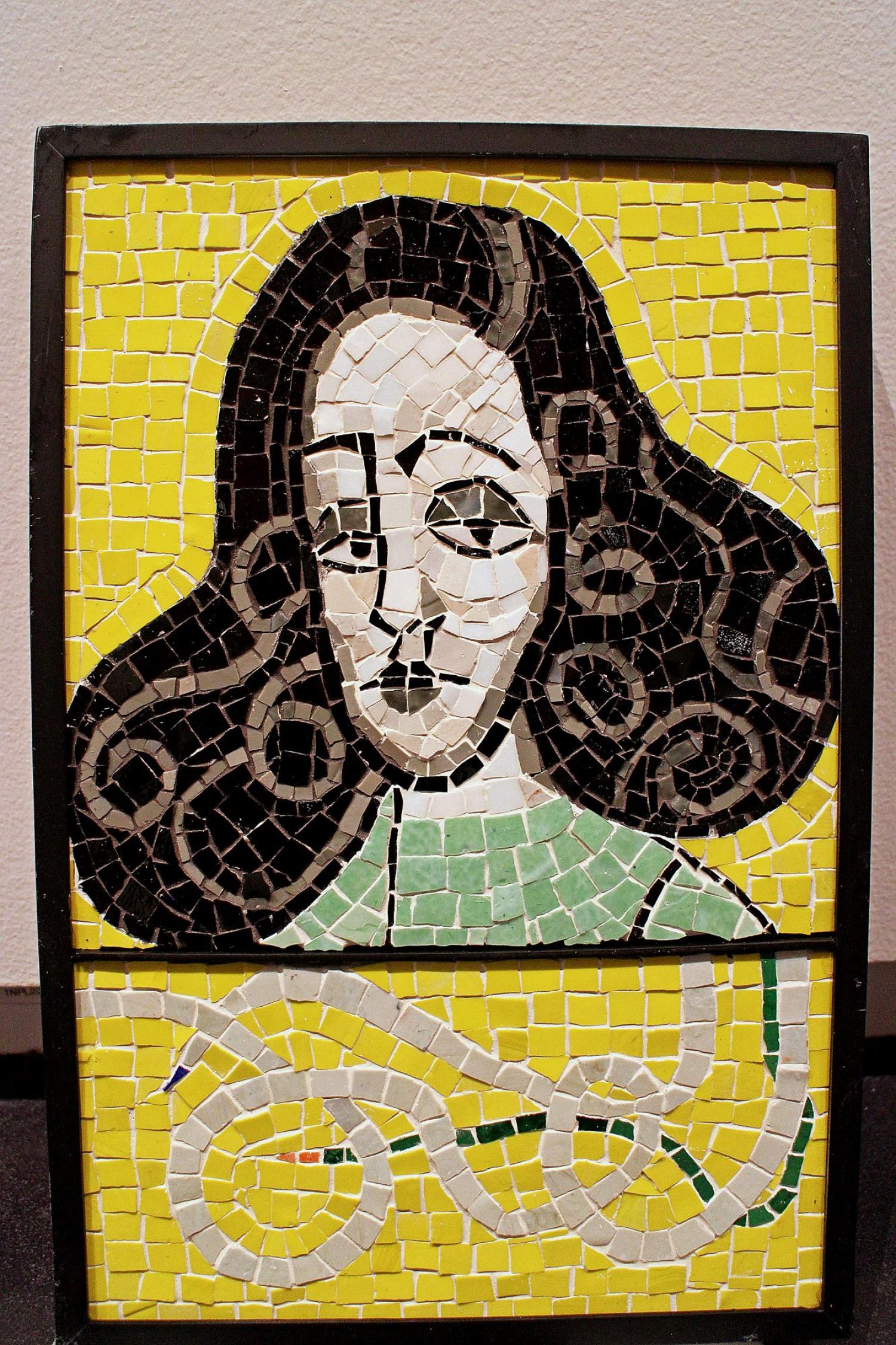 mosaic of woman with dark hair made from clay tile