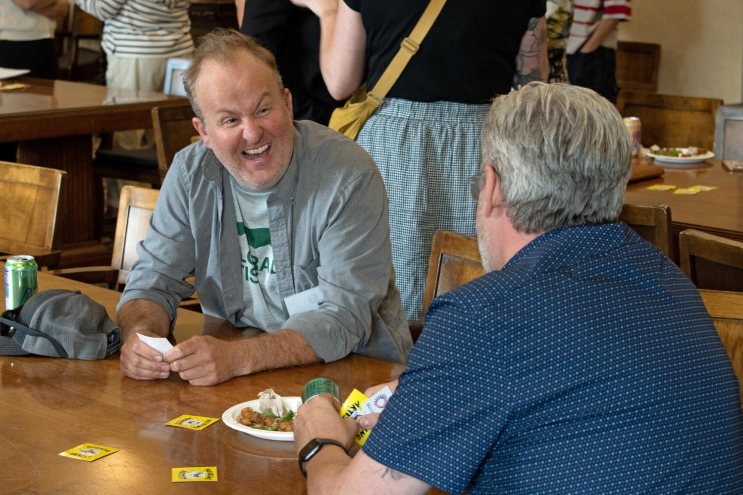 Collin Parson sitting at table and laughing