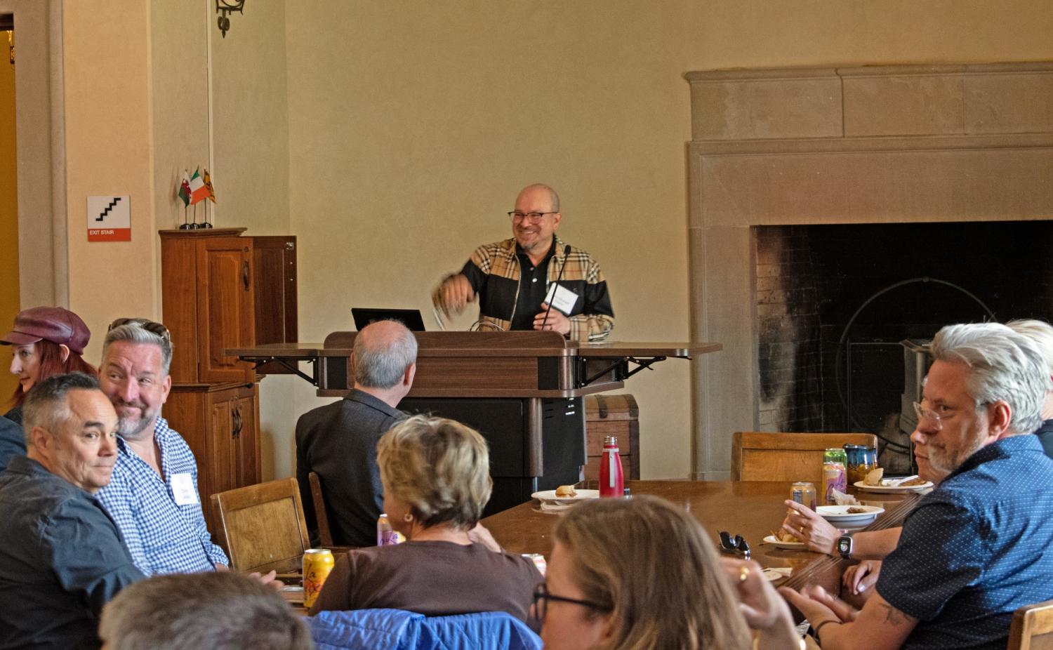 John-Michael Rivera speaking at podium in Norlin Library
