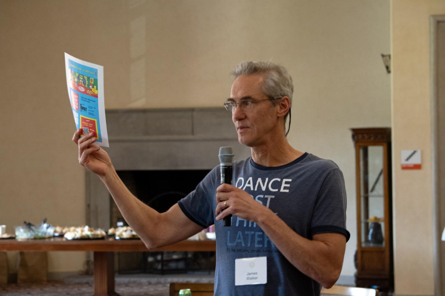 Jim Walker holding flyer