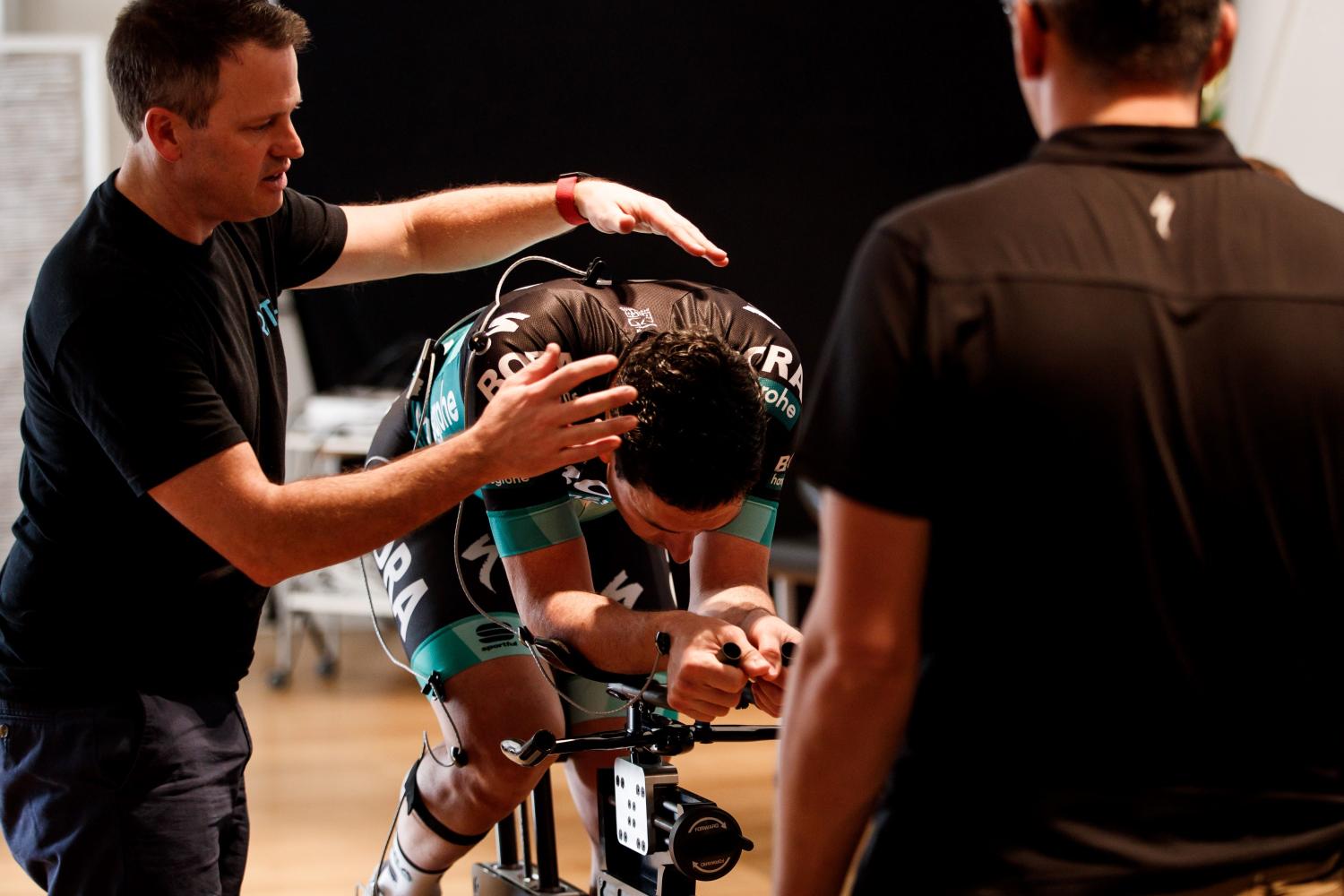 Todd Carver performing bike fitting with cyclist on bike