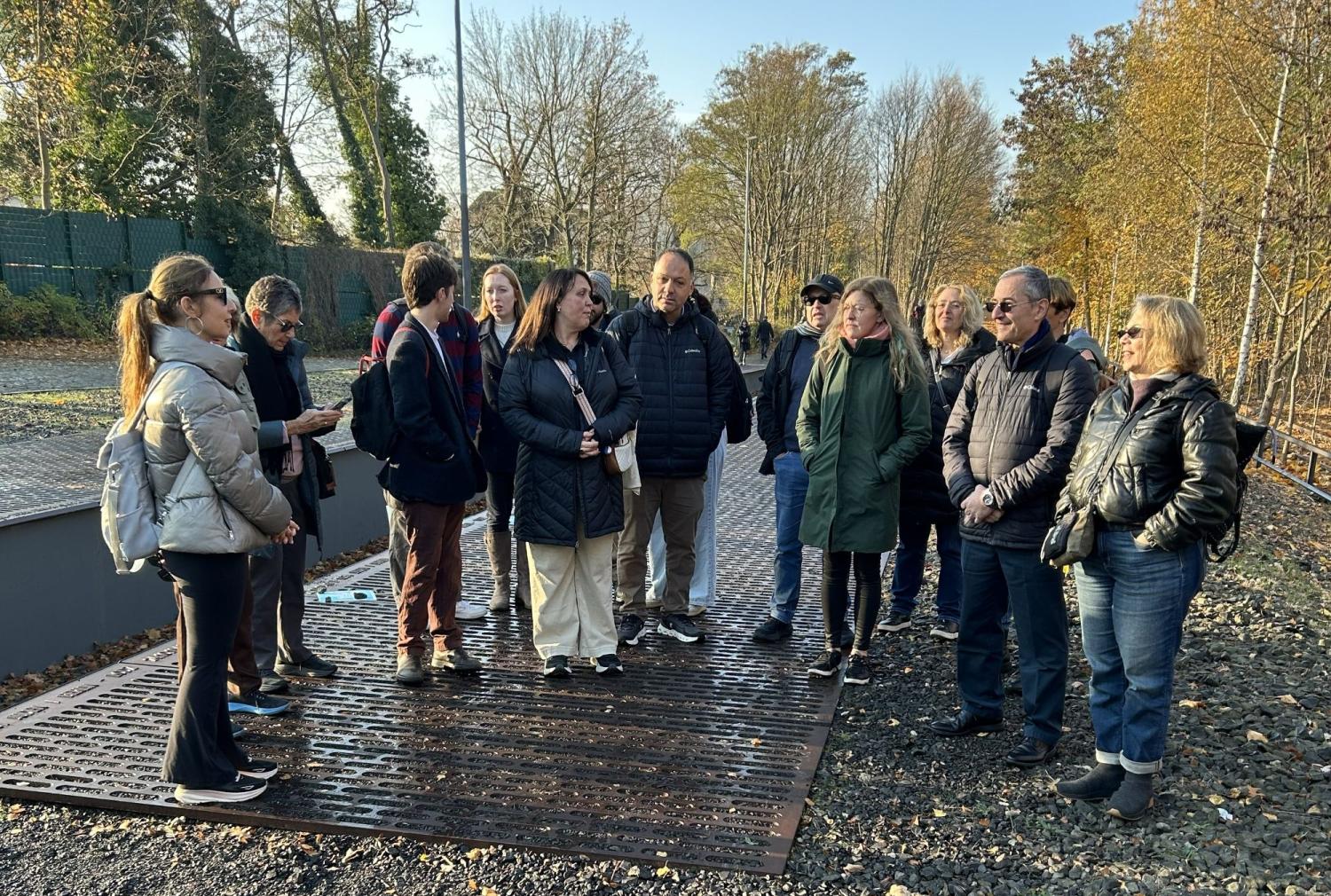 people standing outside in semi-circle