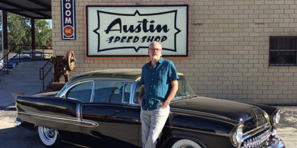 Neurosurgeon Dan Peterson displays his CU-themed black and gold 1955 Chevy outside of Austin Speed Shop.