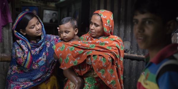 Girl, baby, woman and young man in Dhaka, Bangladesh