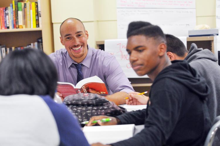 Adam bradley with students in the classroom 