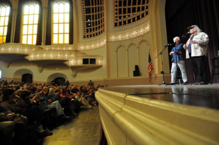 David Crosby and Graham Nash speak to a packed house during the 2011 Conference on World Affairs. Photo by Patrick Campbell.