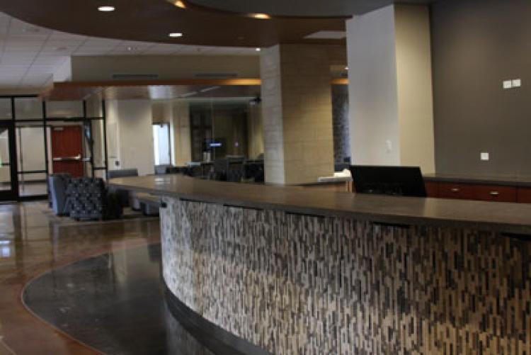 The welcome desk and lounge area at the entrance of Williams Village North. Photo by Noah Larsen.