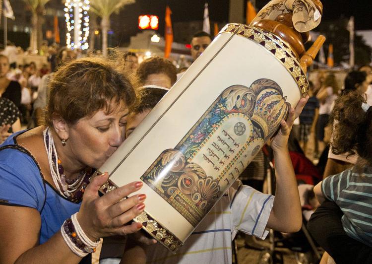 Simchat Torah joyously marks the end of the annual cycle of readings from the Torah.