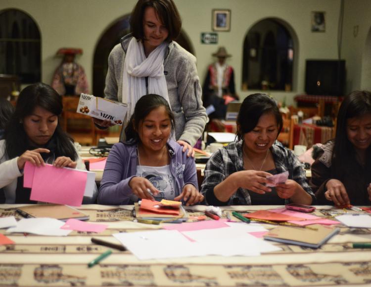 CU Boulder alumna Genevieve Smith, standing, encourages young women during a Visionaria Peru leadership institute. Photo by Chris Carruth.