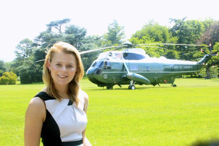 Grazina Dagyte stands on the White House lawn with Marine One in the background. Dagyte, who worked in the Executive Office of the President’s Office of Management and Budget, plans to return to Washington, D.C.