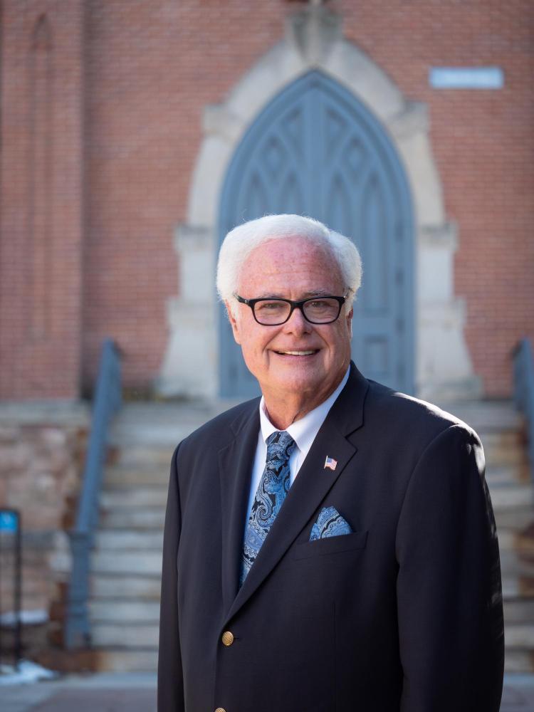 Lyt Harris standing in front of Old Main