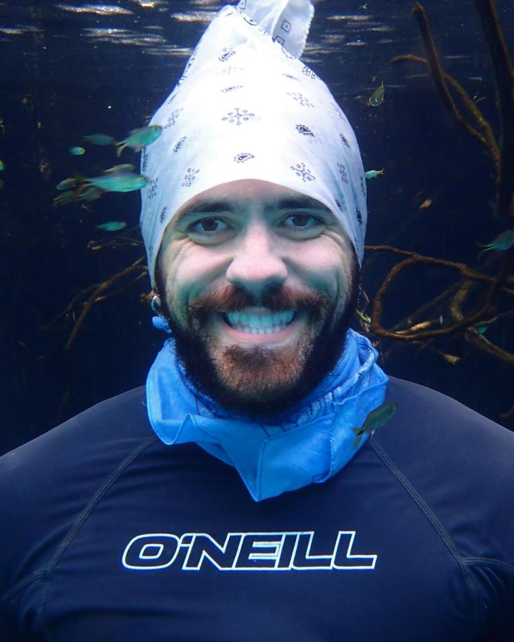 Image of Mike Gil smiling underwater