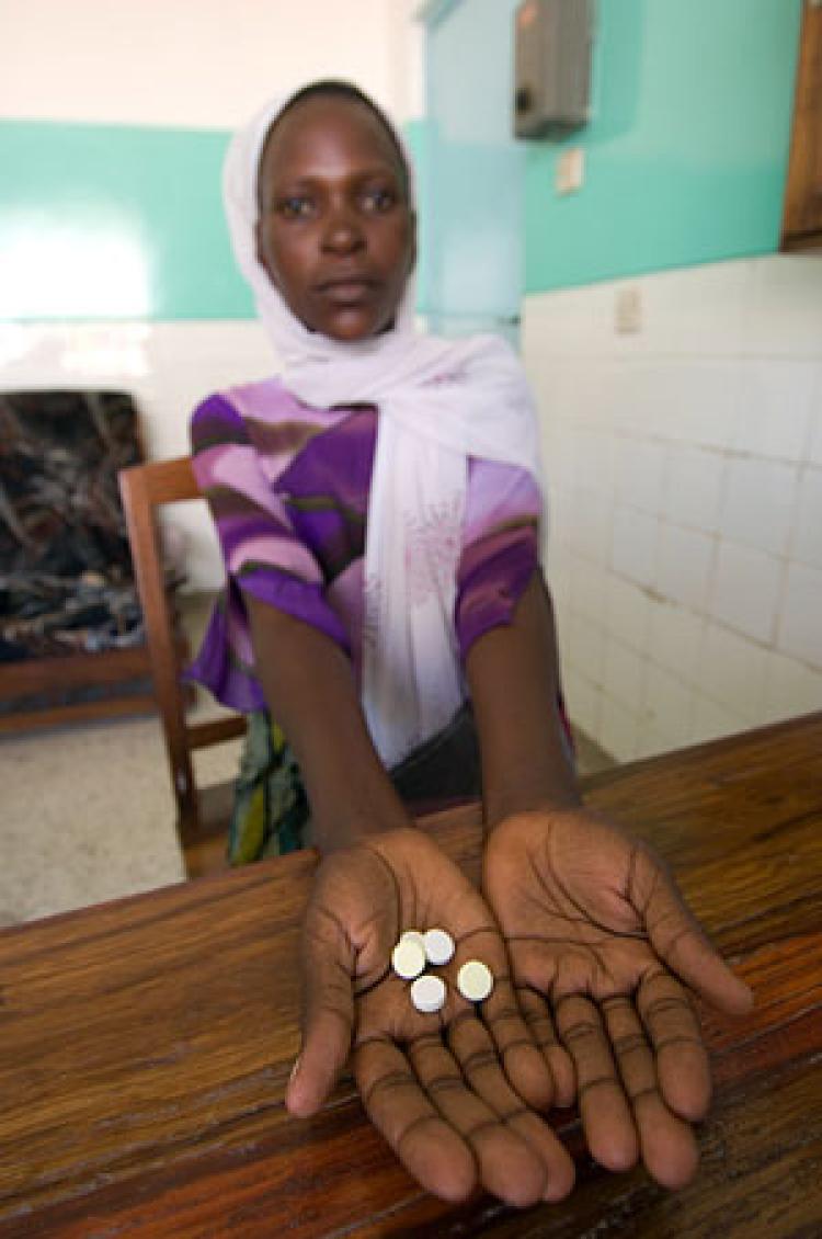 In 2006, after testing positive for HIV and seeing her CD4 count drop to 159 (from a normal level of about 1,000), Penina Petro started on the road to better health with the help of the medications she received from Sekotoure Hospital, Tanzania, under Global HIV/AIDS Program funding. In 2001-02, CU Professor Keith Maskus helped launch a similar program while serving as lead economist in the Development Research Group at the World Bank. Photo by U.S. Health Resources and Services Adminitration.