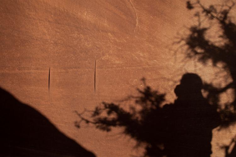Groves in a cave wall used for sharpening tools and weapons
