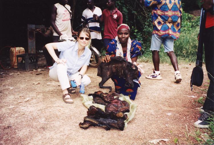 Lambert with a bushmeat vendor at the border of Cote d’ivoire and Liberia. Photo courtesy of Joanna Lambert.