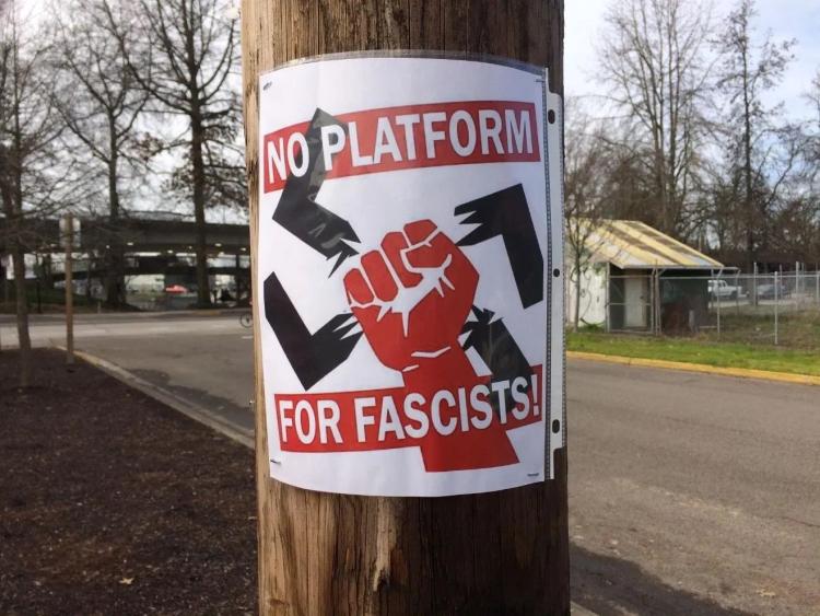 anti-swastika flyer on light pole in Eugene, Oregon
