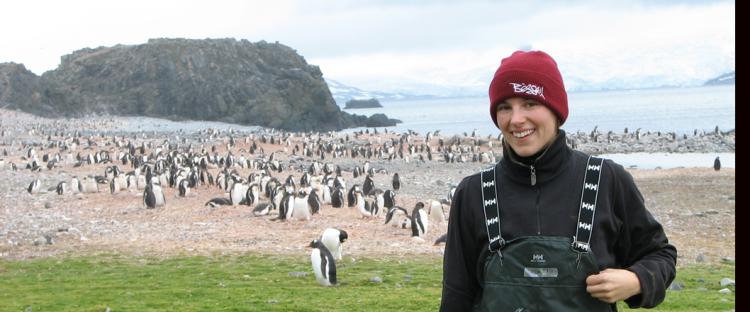 Cassandra in Antartica with a Penguin crop in the background.