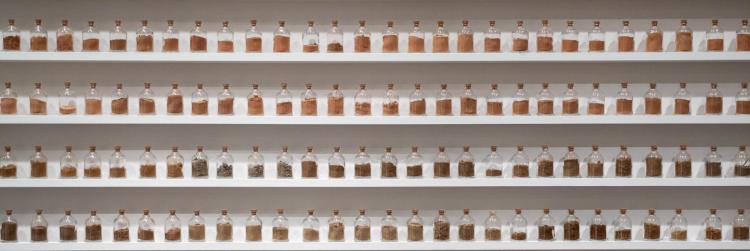 Last Library image featuring jars of sand and rocks