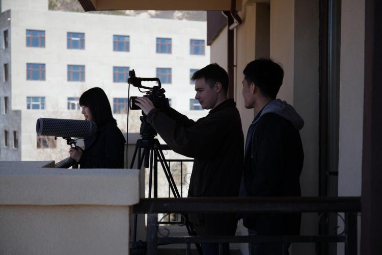 Director Adam James Smith with his production assistant and sound person