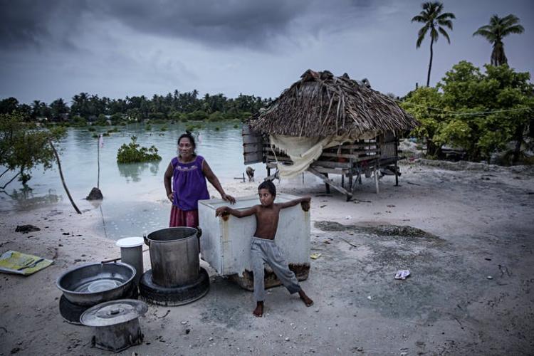 Rising sea levels are making it harder to live in the low-lying islands of Kiribati. Salt water has infiltrated cropland and fresh water supplies, but for many people, migration is impossible. Jonas Gratzer/LightRocket via Getty Images