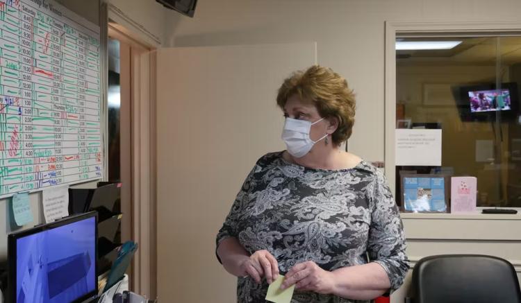 a medical staff looks at a schedule board at the Hope Medical Group for Women in Shreveport, Louisiana.