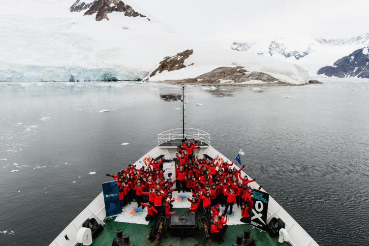 Homeword Bound women group together on a ship in Antartica.