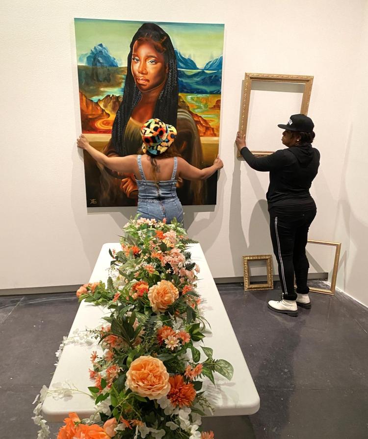 Charlie Billingsley and Von Ross hanging "Lona Misa"