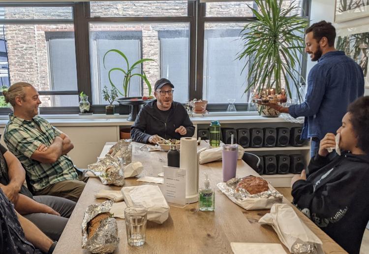 Nick Houy with colleagues at lunchtable