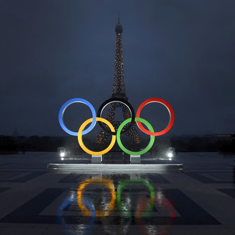 Olympic rings in front of Eiffel Tower