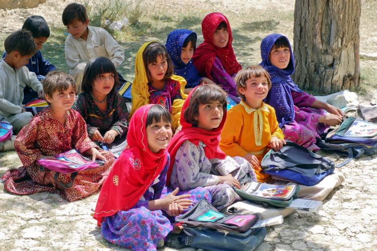 girls in an outdoor school classroom in Afghanistan