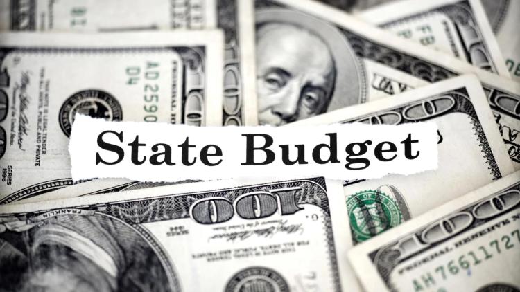 illustration with U.S. paper currency and words "state budget"