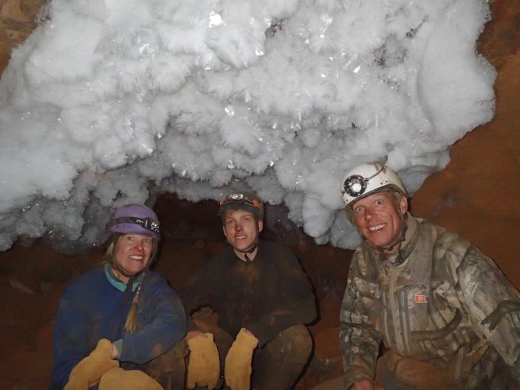 thumbnail_#2 Debbie, Nathan and Dave Steinmann surrounded by cave ice crystals, by Sophia Zedalis