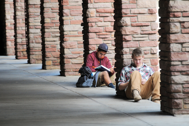 students on campus studying