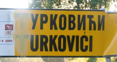A Bosniak village road sign that has been defaced by Serb nationalists derides them as 'Turks' and indicates lingering ethnic tension.