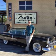 Neurosurgeon Dan Peterson displays his CU-themed black and gold 1955 Chevy outside of Austin Speed Shop.