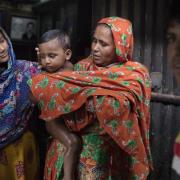 Girl, baby, woman and young man in Dhaka, Bangladesh
