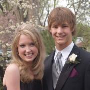 Caitlin Epple and Kyle Metcalf pose before going to their high-school prom.