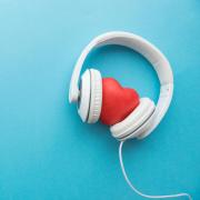 Image of headphones wrapped around a heart