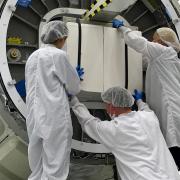 NASA scientists including Kellogg integrating some equipment