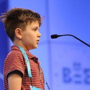 student on stage with microphone