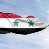 Syrian flag against blue sky