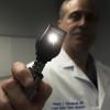 Stock photograph of a doctor testing for a concussion